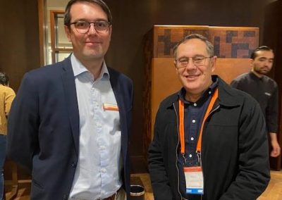 Two men standing next to each other at an event in Australia.